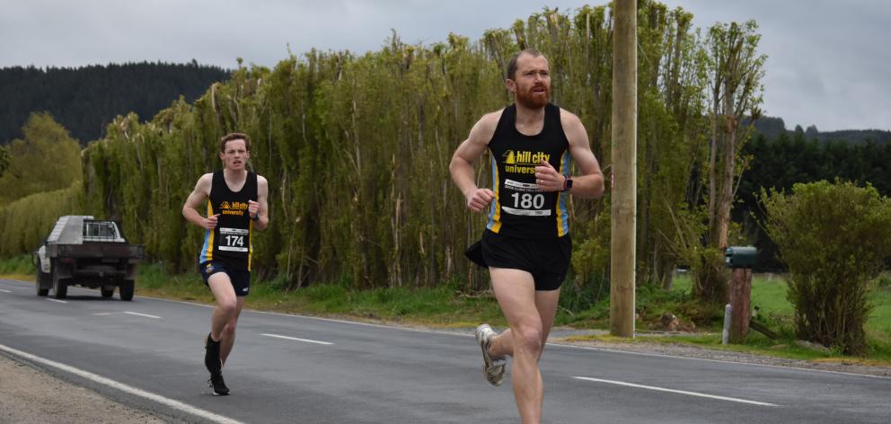 Stafford Thompson breaks away from early leader Brad Trebilcock during the Otago Half-marathon...