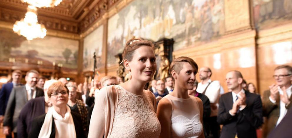Same-sex couples are seen after getting married during a media call at the town hall after the German parliament approved marriage equality in a historic vote. Photo: Reuters 