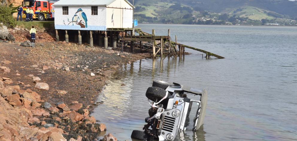 The Jeep crashed in to Otago Harbour just after 9am today. Photo: Gregor Richardson