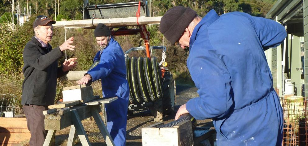 Volunteers at work constructing new bait stations. Photo: Alyth Grant