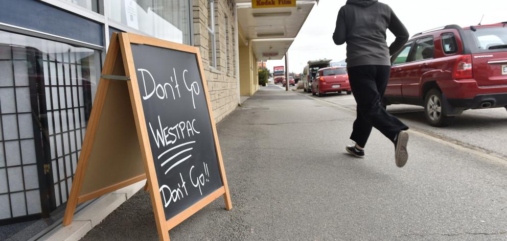 A sign outside another Ranfurly store lobbies for the bank to remain open.
