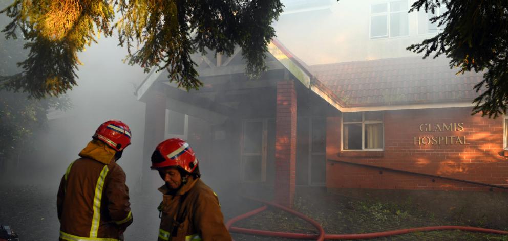 Fire crews clean up after bringing  a fire at the abandoned Glamis Hospital in Mornington under...