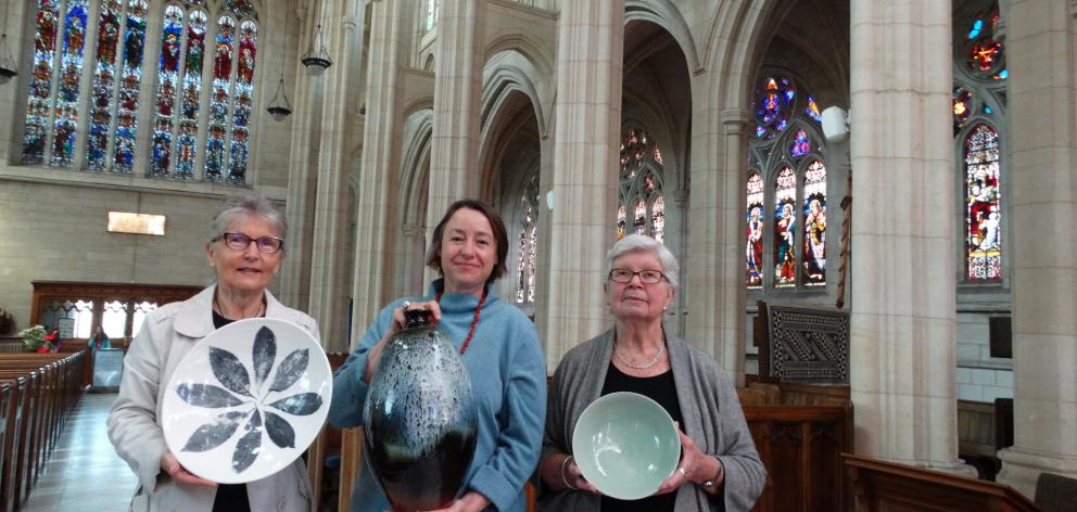 The beauty of St Paul’s Cathedral makes a fabulous backdrop for an exhibition of pottery organised by (from left) Nicole Kolig, Marion Familton and Josephine Waring in support of the Dunedin Night Shelter Trust. PHOTO: BRENDA HARWOOD