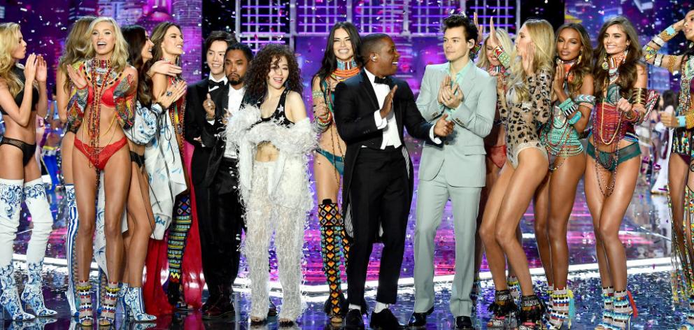 Singers Leslie Odom Jr. and Harry Styles at the 2017 Victoria's Secret Runway Show with this year's models. Kiwi Stella Maxwell on the far-left. Photo: Getty Images