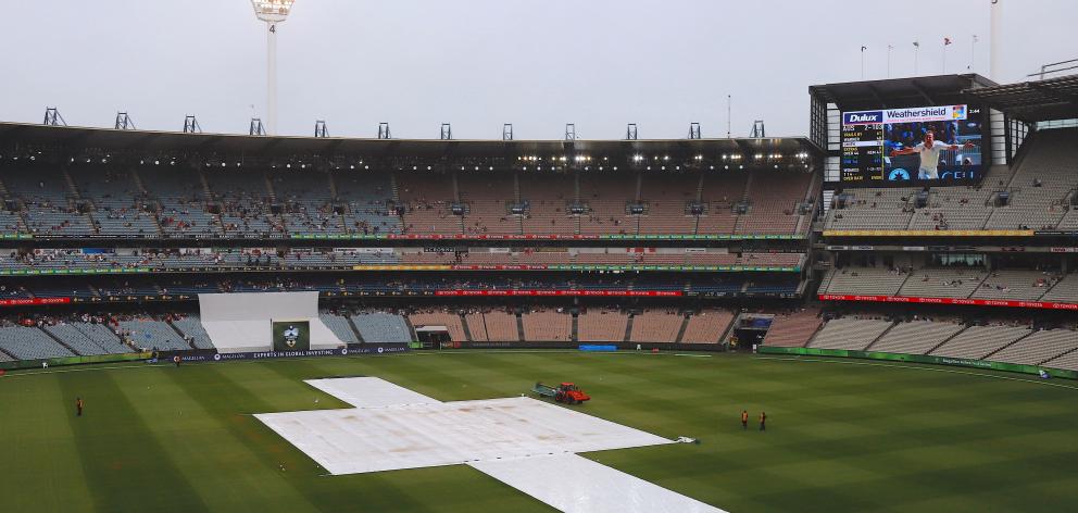 A moist Melbourne Cricket Ground on the fourth day of the fourth Ashes test. Photo: Reuters