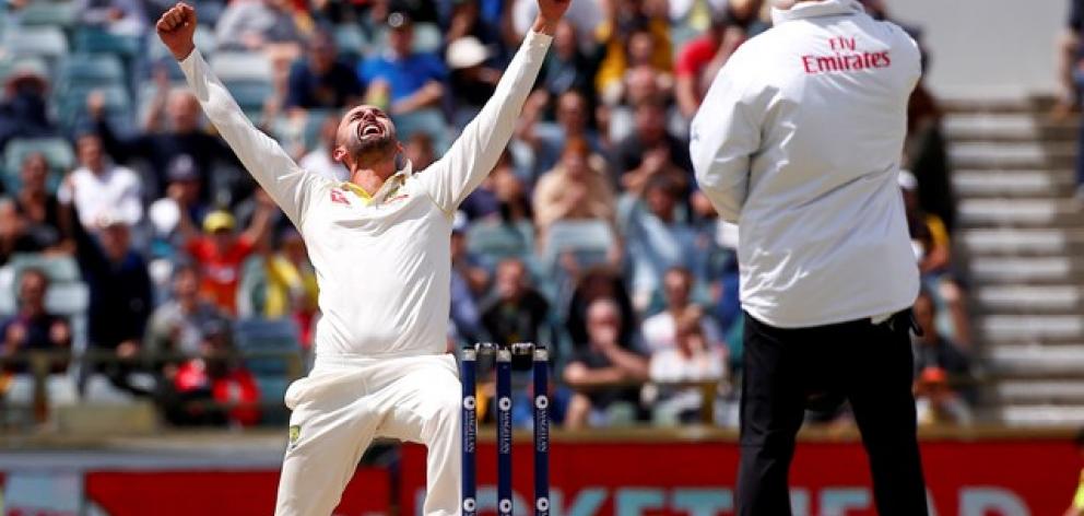 Australia's Nathan Lyon celebrates after dismissing England's Moeen Ali during the fifth day of the third Ashes cricket test match. Photo: Reuters