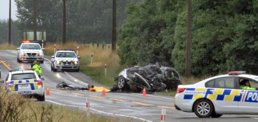 Police work at the scene of a fatal two-car crash about 1km north of Glenavy. Photo: Hamish MacLean