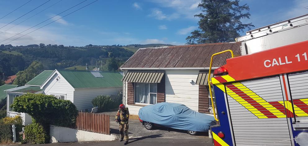 Fire and Emergency New Zealand attend a fire at a property in North Dunedin. Photo: Vaughan Elder
