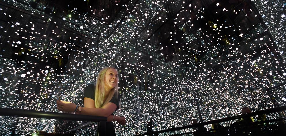Otago Museum marketing manager Charlotte Neilson experiences an ‘‘Infinity Room’’ created as...