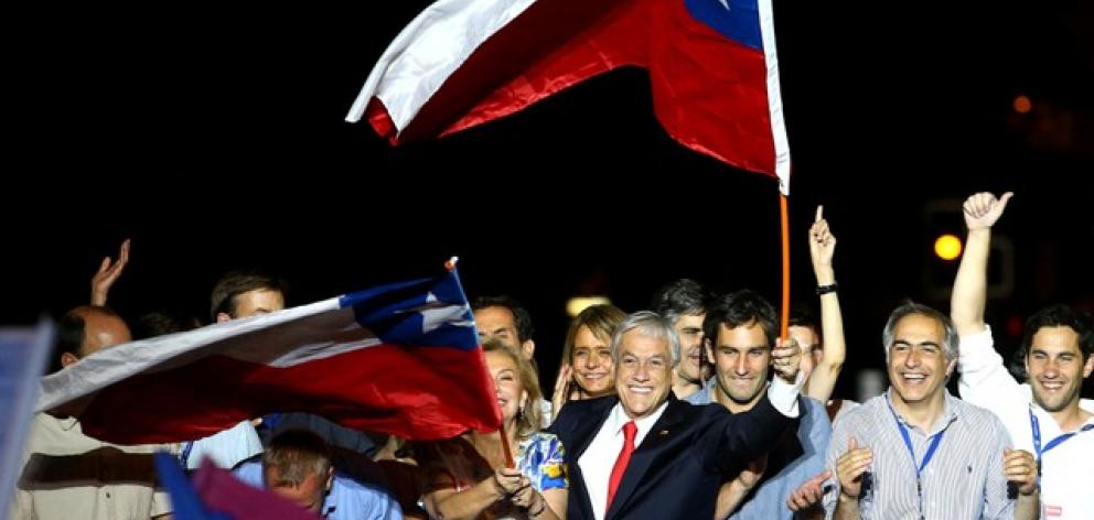 Pinera and his wife Cecilia wave flags after winning Chile's presidential election, in Santiago. Photo: Reuters Pinera and his wife Cecilia wave flags after winning Chile's presidential election, in Santiago. Photo: Reuters