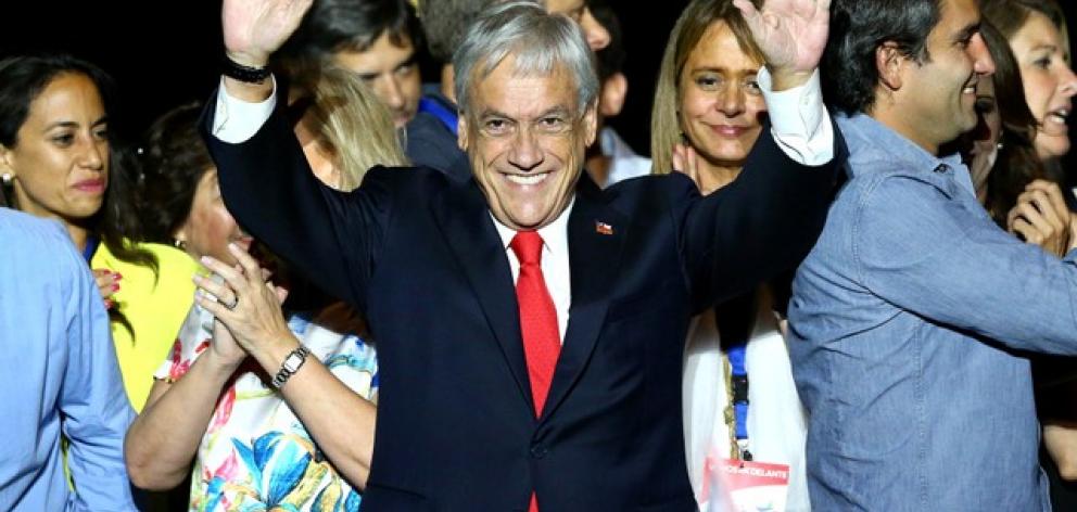 Presidential candidate Sebastian Pinera waves to supporters after winning the election. Photo: Reuters Presidential candidate Sebastian Pinera waves to supporters after winning the election. Photo: Reuters