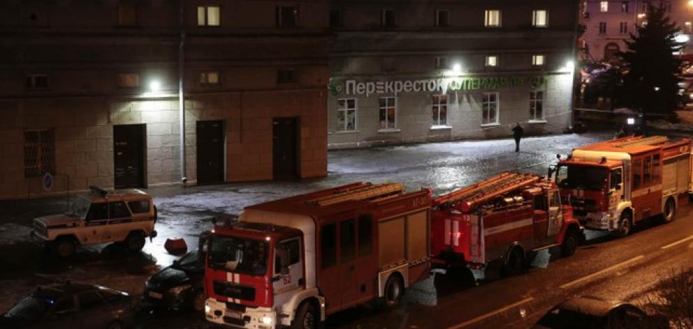 Vehicles of emergency services are parked near a supermarket after an explosion in St Petersburg. Photo: Reuters