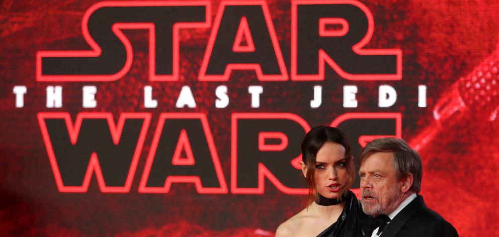 Actors Daisy Ridley and Mark Hamill pose for photographers as they arrive for the European Premiere of 'Star Wars: The Last Jedi', at the Royal Albert Hall in central London Photo: Reuters