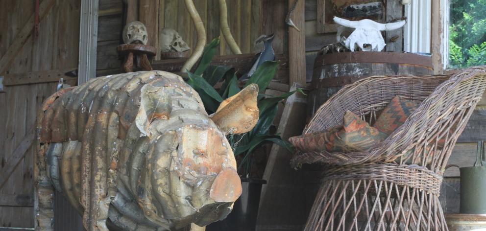 This rustic piece by Jeff Thomson blends in with the backyard loggia.