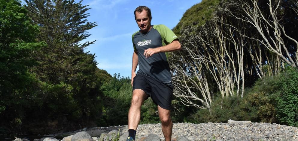 Scott Payne trains over a rocky course in Whare Flat. Photo: Wayne Parsons