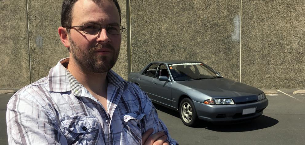 Southern Skyline Enthusiasts president Andrew Webster displays his 1990 Nissan Skyline in the car park near Dunedin Ice Stadium, where a cruise will depart from on Sunday. 