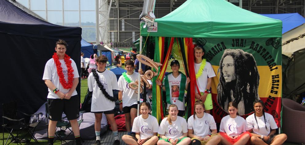 Members of the One Love Relay for Life team relax at their tent site, which had a Bob Marley theme, during the 2016 event at Forsyth Barr Stadium. PHOTO: SUPPLIED