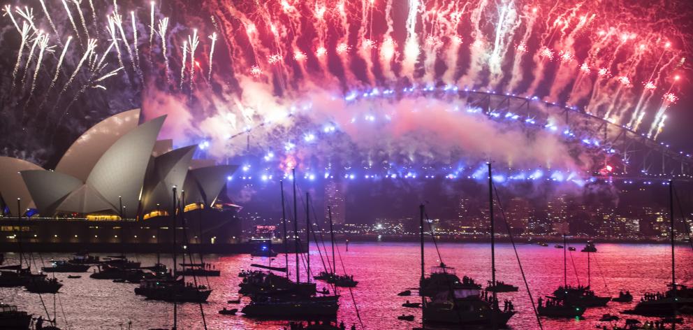 Fireworks above the Opera House and Harbour Bridge for New Year's Eve on January 1, 2018 in...