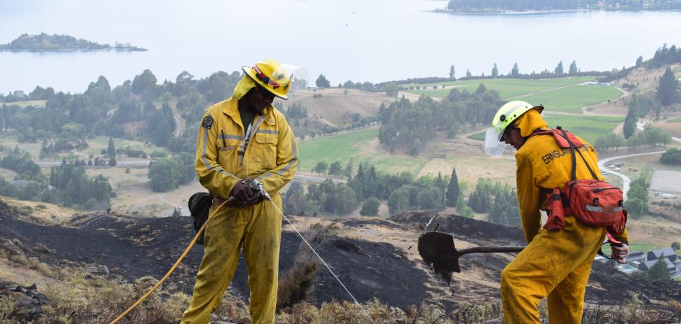 Fire officers Joe Natuikata and Johnathon Moate, of Gore, at work on Mt Alpha. Photo: Kerrie...