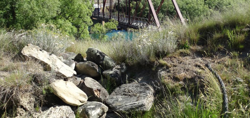 The remains of the cable and anchor points for the Luggate ferry with the Red Bridge in the...