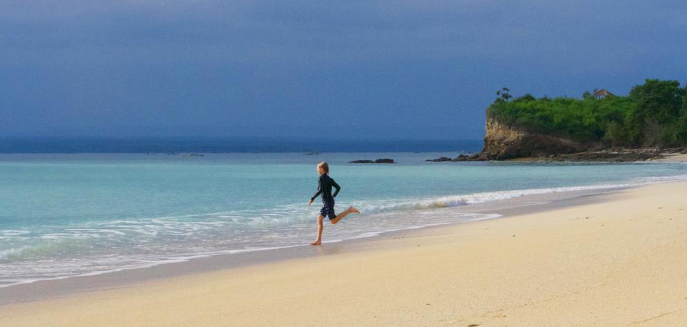 The deserted beach where the kids and I went swimming and paddle-boarding every day. We even got...