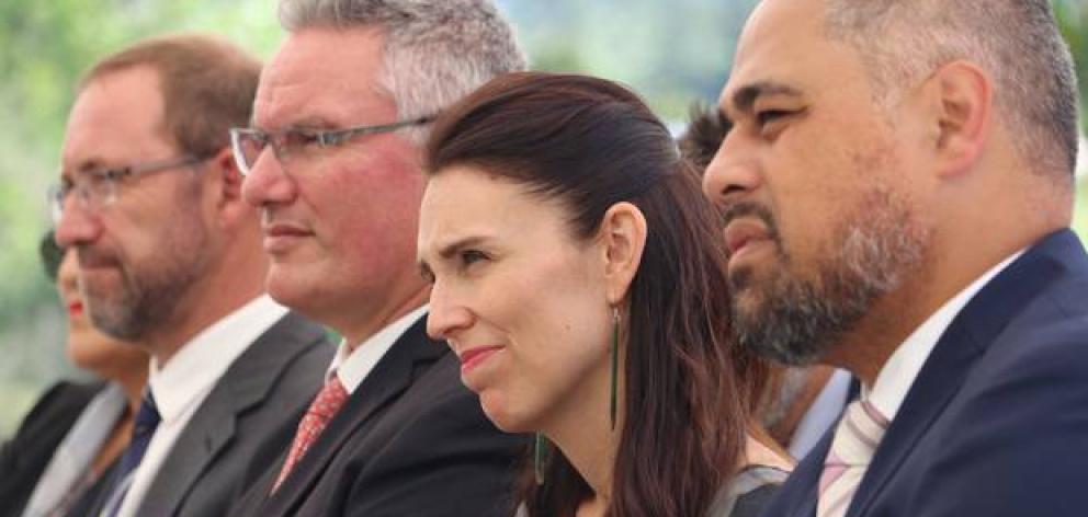Prime Minister Jacinda Ardern listens to a welcome from Maori Wardens at Bay of Islands Holiday Park with, from left, Ministers Andrew Little, Kelvin Davis and Peeni Henare. Photo: NZ Herald