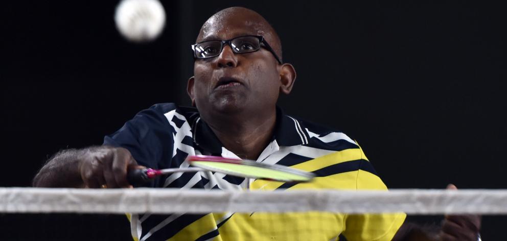 Dev Senthiya  is all concentration during the  badminton at the New Zealand Masters Games...