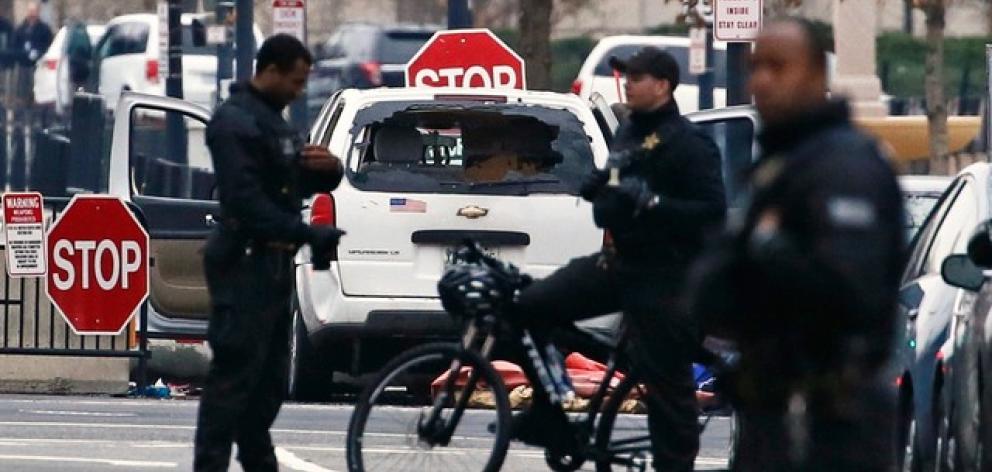 A passenger vehicle that struck a security barrier sits near the White House in Washington. Photo: Reuters