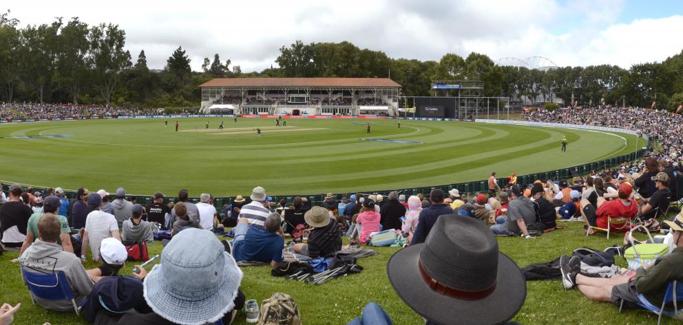 A crowd settles in around Dunedin’s ‘‘village green’’, the University Oval, last month. Photo:...