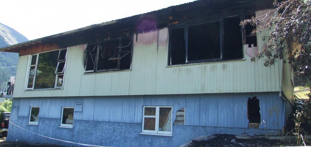 This Weaver St, Queenstown, house was badly damaged by fire yesterday. PHOTO: GUY WILLIAMS
