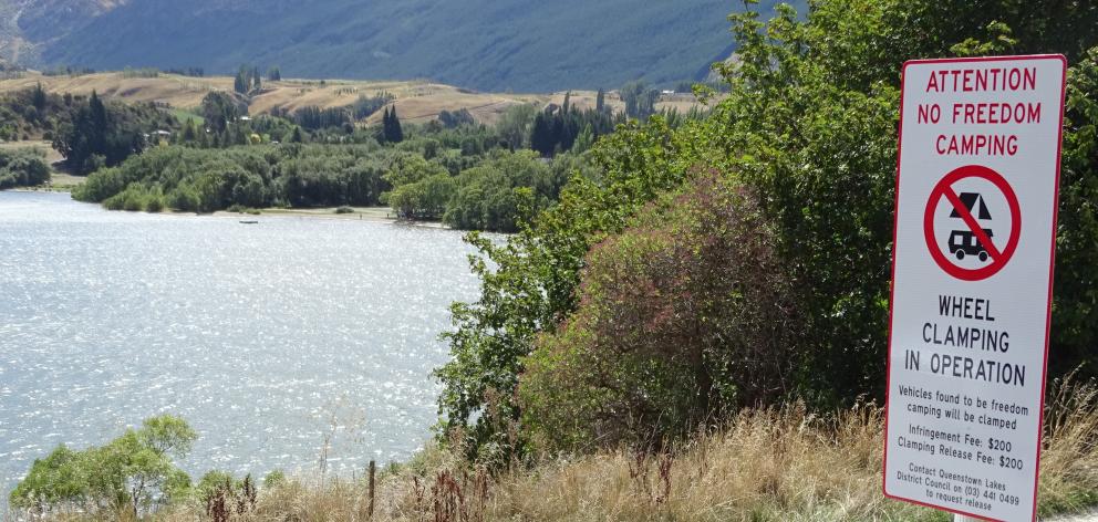 New signs at the entrance to the northern end of Lake Hayes advise freedom campers they are no...