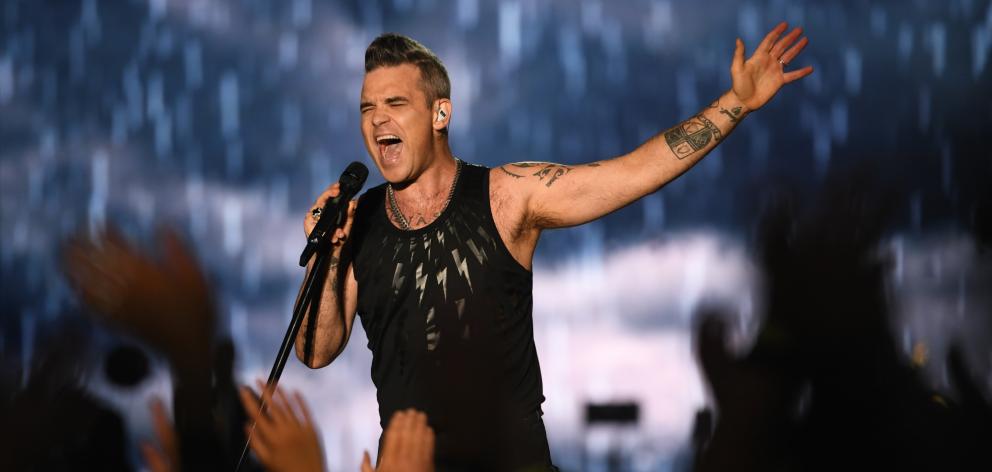 Robbie Williams rocks the 16,000-strong crowd at Forsyth Barr Stadium in Dunedin on Saturday...