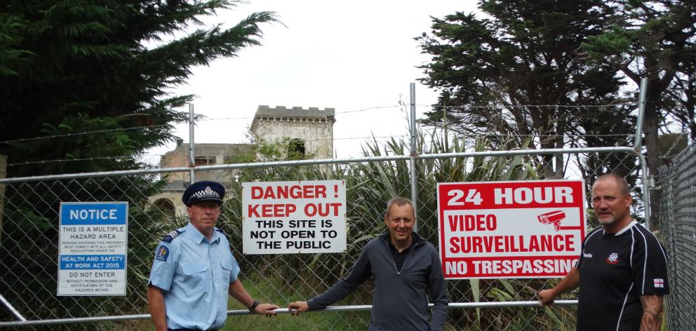 The warning signs spell out the clear message trespassers will not be tolerated at Cargill’s Castle, say (from left) Sergeant Trevor Thomson, Cargill’s Castle Trust chairman Steven de Graaf and Police Search and Rescue co-ordinator Nick Wells. PHOTOS: BRE