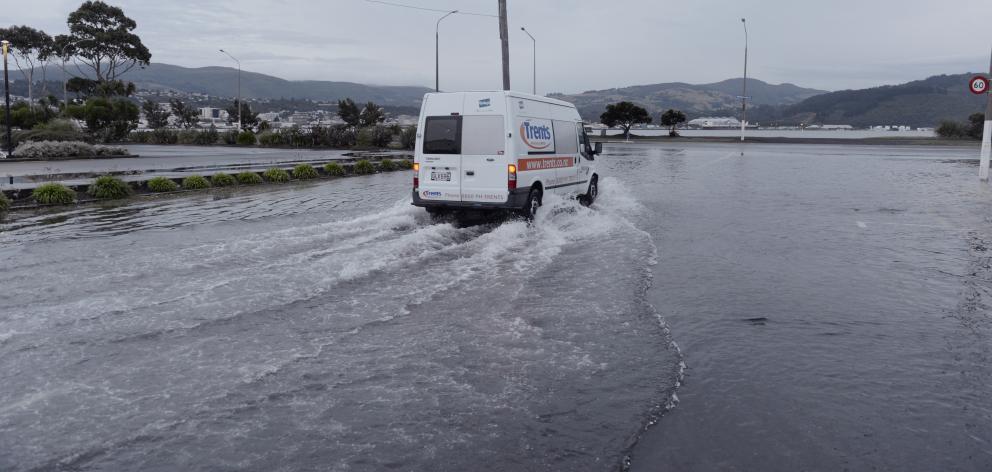 A delivery van ploughs through surface flooding at the intersection of Teviot St and Portsmouth...