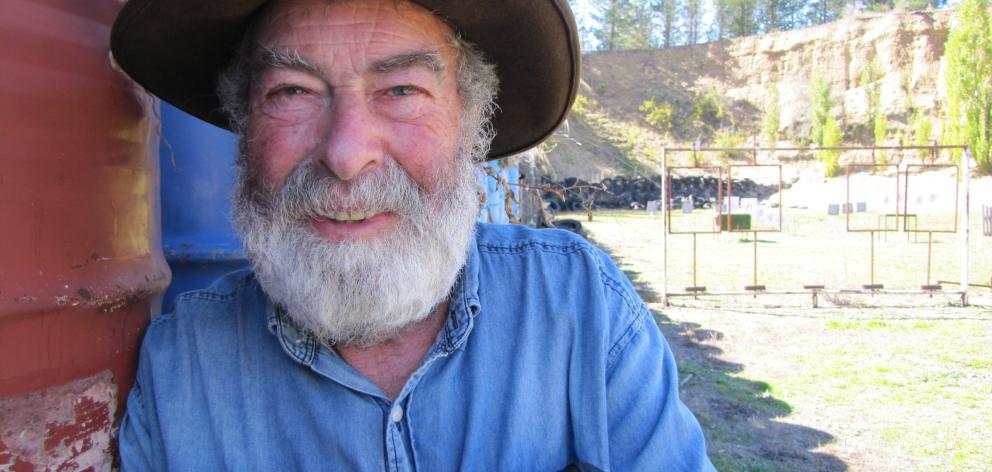 Central Otago Pistol Club president John Holley, of Roxburgh, known as ‘‘Big Bad John’’, takes a...
