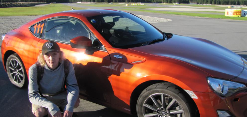 Central Otago Young Driver Programme participant Ethan Wedlock (16), of Cromwell, admires the Highlands Motorsport Park's Toyota 86 on day one of the driving programme at Highlands yesterday. Photo: Pam Jones