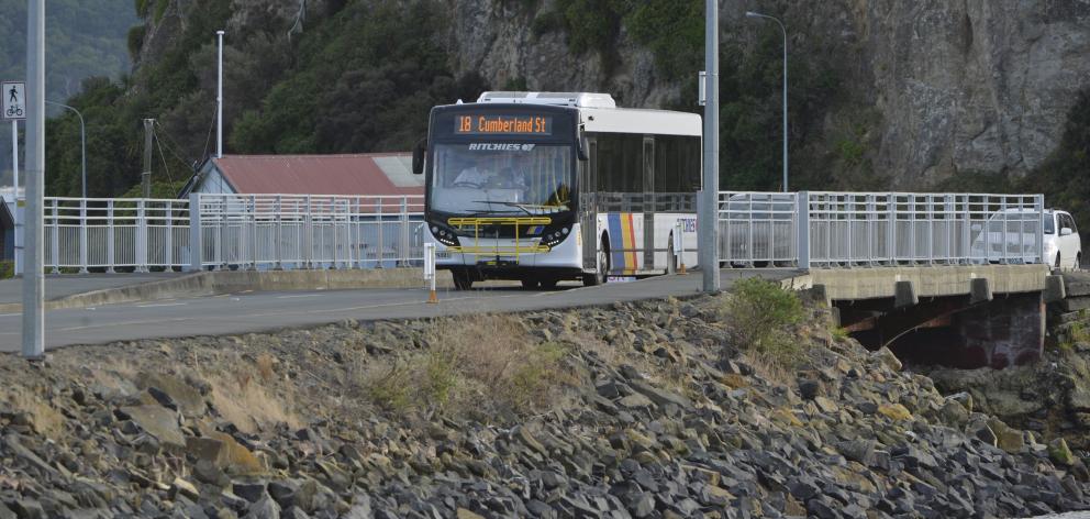 A Ritchies bus, on the Otago Peninsula route, passes a new temporary bus stop on the Andersons...