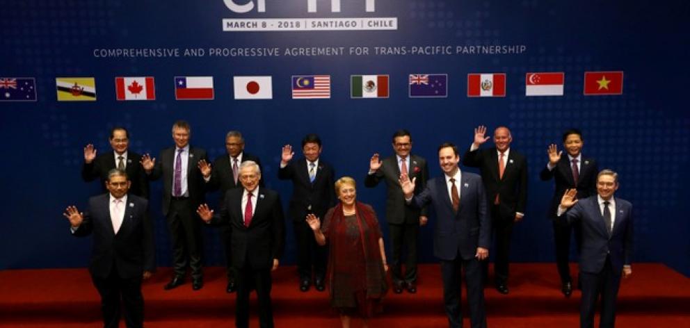 Members of Trans-Pacific Partnership trade deal pose for an official picture before the signing agreement ceremony in Santiago. Photo: Reuters