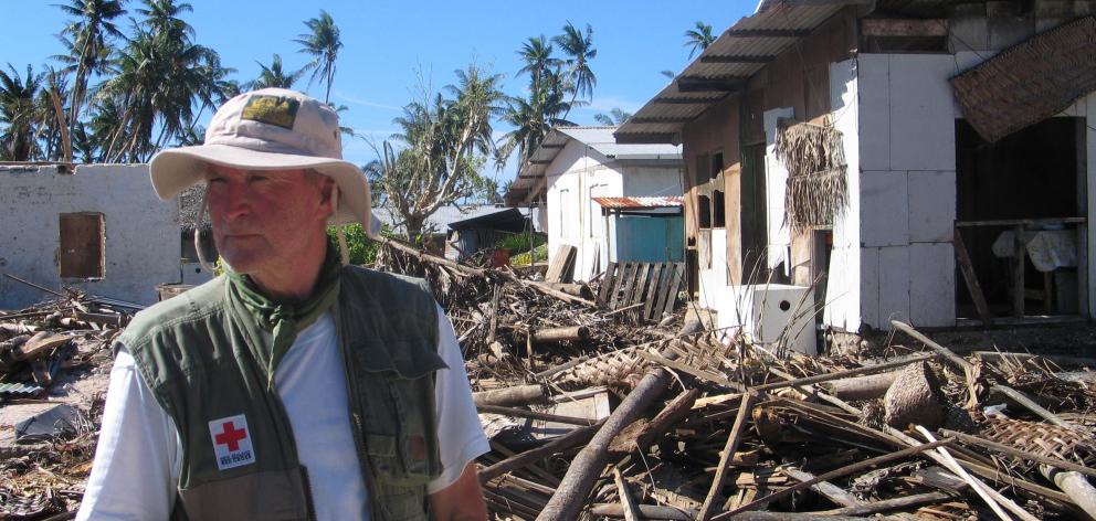 Mr Clark surveys damage on the remote Pacific island of Pukapuka following tropical cyclone Percy...