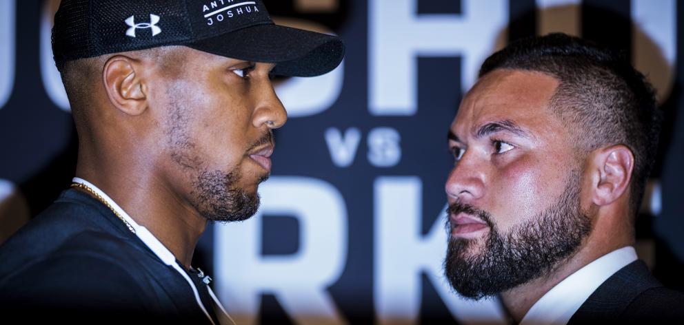 Anthony Joshua (left) and Joseph Parker square off during a press conference at the Dorchester...