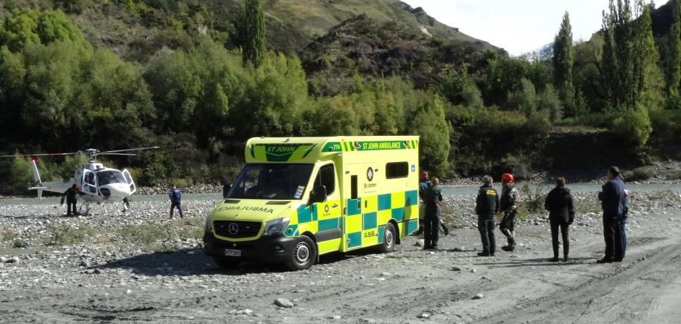 A Lakes District Air Rescue Trust helicopter prepares to take off from a beach at Arthurs Point,...