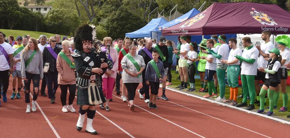 Leading the way ... Piper Dugald McKay , of Dunedin, leads the first lap of the Relay for Life at...