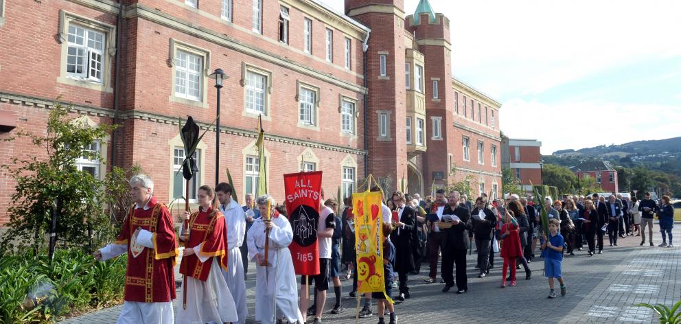 Prof David Fielding, of the University of Otago, leads a procession from Selwyn College to a...