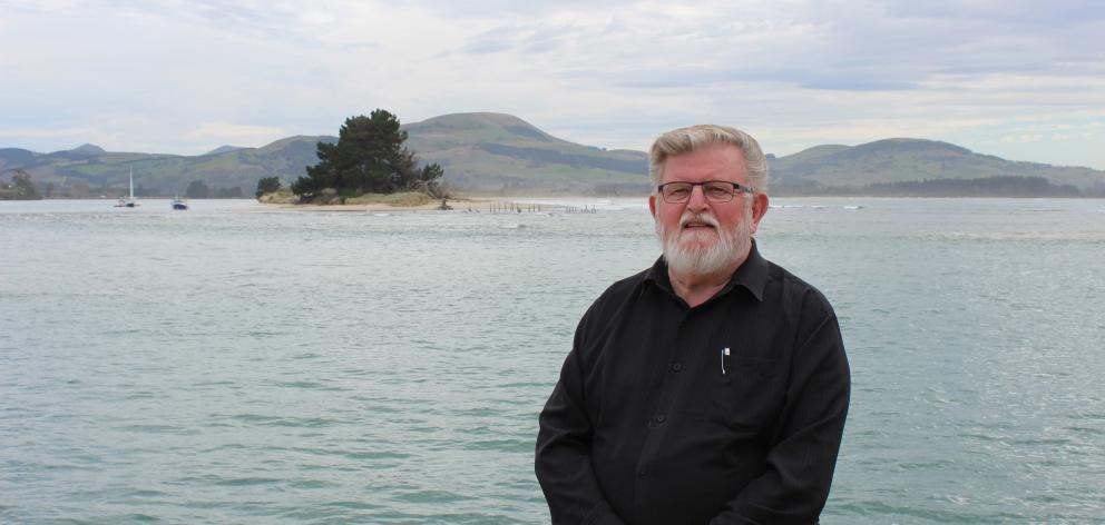 Waikouaiti Coast Community Board chairman Alasdair Morrison in front of the retreating Karitane spit, which he says needs repairs before winter. PHOTO: ELLA STOKES