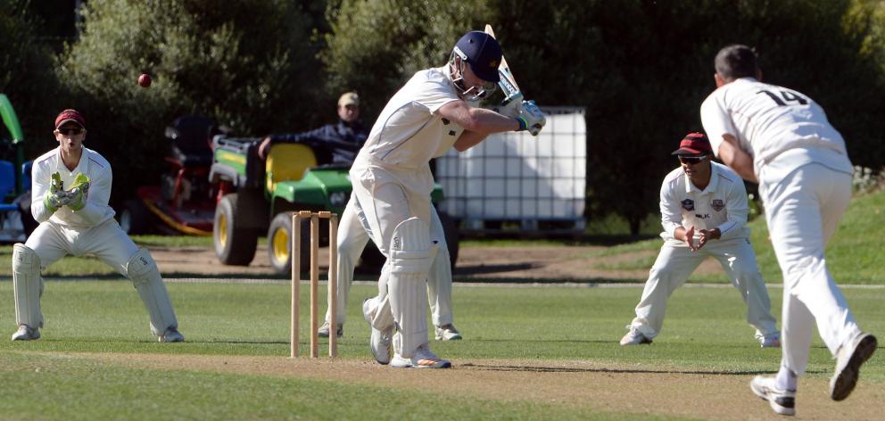 Otago batsman Jimmy Neesham lets a delivery from Canterbury bowler Andrew Ellis go through to...