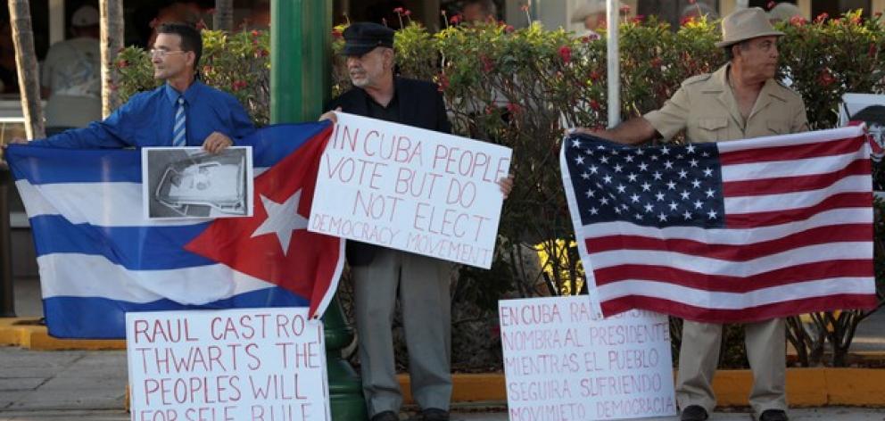 Cuban Americans protest Raul Castro leaving office as Cuba's president and Miguel Diaz Canel named as the new president, in Miami. Photo: Reuters Cuban Americans protest Raul Castro leaving office as Cuba's president and Miguel Diaz Canel named as the new president, in Miami. Photo: Reuters