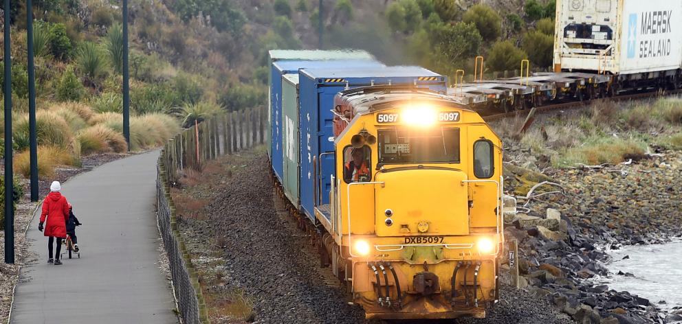 A young cyclist rides on a cycleway near railway tracks at Ravensbourne. Photo: Stephen Jaquiery