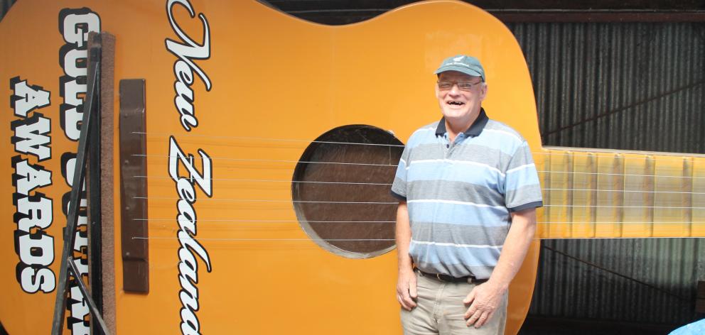 Gore Country Music Club member Alan Ritchie stands with the giant guitar that has been on display during past MLT New Zealand Gold Guitar Awards events. PHOTO: MARGARET PHILLIPS