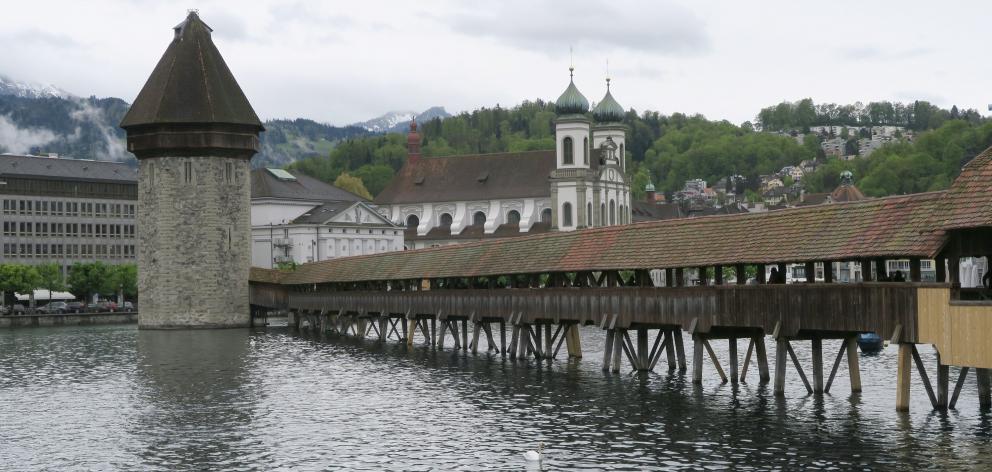 One of Lucerne’s most famous sites is the Kapellbrucke, a covered wooden footbridge over the...