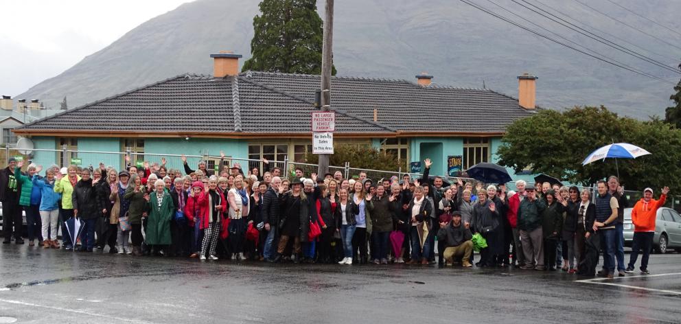 More than 100 people turned out to have their photo taken in front of the former Queenstown...